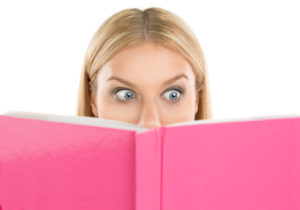 Image of a woman reading a lesbian fiction book